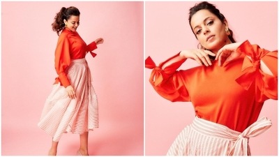 Kangana Ranaut has been raising the elegant quotient with her promotional looks of Dhaakad. Earlier, she was seen promoting the film in a vibrant tangerine top paired with a flared striped skirt. (Instagram/@kanganaranaut)