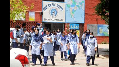 Class 12 students coming out from Government Senior Secondary School, Sector 45, Chandigarh, after appearing in the CBSE English exam on Friday. (Ravi Kumar/HT)