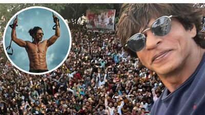 Shah Rukh Khan takes a selfie with his fans on Eid (above); a still from Pathaan (inset) Shah Rukh Khan takes a selfie with his fans on Eid (above); a still from Pathaan (inset)