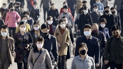 People wearing protective face masks commute in Pyongyang, North Korea March 30, 2020. CREDIT: Kyodo/via REUTERS (REUTERS)