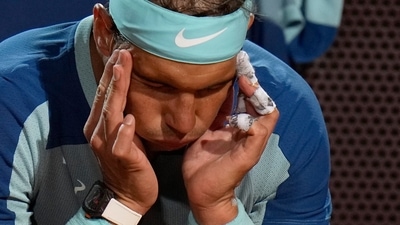 Rafael Nadal of Spain touches his head during his match against Denis Shapovalov of Canada at the Italian Open tennis tournament (AP) Rafael Nadal of Spain touches his head during his match against Denis Shapovalov of Canada at the Italian Open tennis tournament (AP)