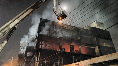 Firefighters try to douse a fire which broke out in a building at Mundka, in West Delhi on Friday. (PTI) Firefighters try to douse a fire which broke out in a building at Mundka, in West Delhi on Friday. (PTI)