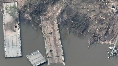 In this handout photo provided by the Ukraine Armed Forces, a ruined pontoon crossing with dozens of destroyed or damaged Russian armored vehicles on both banks of Siverskyi Donets River after their pontoon bridges were blown up in eastern Ukraine. (Ukraine Armed Forces via AP) (AP)