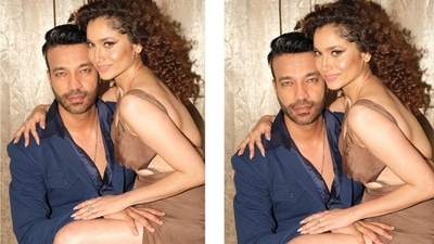 Meanwhile, Vicky complemented his wife in a dark blue blazer with notch lapel collars and a closed front, teamed with a matching button-down shirt and straight fit pants. A pair of black dress shoes and a sleek silver chain completed his ensemble. (Instagram/@ankitalokhande ) Meanwhile, Vicky complemented his wife in a dark blue blazer with notch lapel collars and a closed front, teamed with a matching button-down shirt and straight fit pants. A pair of black dress shoes and a sleek silver chain completed his ensemble. (Instagram/@ankitalokhande )