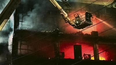 Fire officials try to douse a fire in a four storied building, in New Delhi. (HT Photo) Fire officials try to douse a fire in a four storied building, in New Delhi. (HT Photo)
