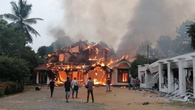 One of the many houses of Rajapaksas set on fire by unruly mob in the recent wave of violence. One of the many houses of Rajapaksas set on fire by unruly mob in the recent wave of violence.
