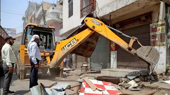 Anti-encroachment drive at Khyala Road on Friday. (ANI)