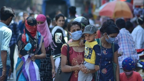 In spite of the Covid-19 cases being on the rise again, very few pedestrians seen walking wearing masks while many are found without masks throwing caution to the wind (Praful Gangurde/HT Photo)