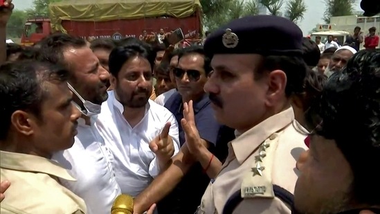 AAP MLA Amanatullah Khan at Madanpur Khadar Ward where SDMC undertakes an anti-encroachment drive, in New Delhi on Thursday (ANI Photo)