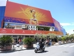 A scooter drives past the Palais des festivals appears during the 72nd international film festival, Cannes, southern France on May 13, 2019. This year marks Cannes' 75 anniversary. (AP File)