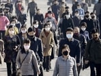 People wearing protective face masks commute in Pyongyang, North Korea (Kyodo/via REUTERS)
