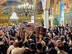 Palestinian mourners wave national flags as they carry the casket of Shireen Abu Aklel inside a church, in Jerusalem, (AFP) Palestinian mourners wave national flags as they carry the casket of Shireen Abu Aklel inside a church, in Jerusalem, (AFP)