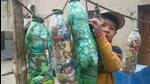 They gather and stuff the non-biodegradable pollutants into empty plastic bottles, which are reused as poly bricks. (HT Photo) They gather and stuff the non-biodegradable pollutants into empty plastic bottles, which are reused as poly bricks. (HT Photo)