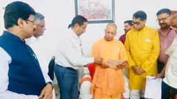 Traders inviting Chief Minister Yogi Adityanath to attend a seminar to be held in Kashi.  (excl. tax)