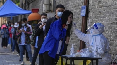 Residents line up for Covid-19 testing in the Chaoyang district in Beijing. (AP) Residents line up for Covid-19 testing in the Chaoyang district in Beijing. (AP)
