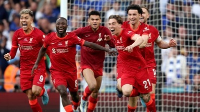 Liverpool's Kostas Tsimikas celebrates after scoring the winning penalty in a penalty shootout (AP)