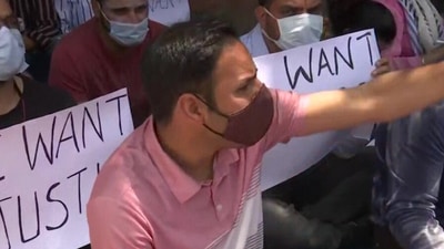 A demonstrator at a protest site in Srinagar, on Saturday. (ANI)
