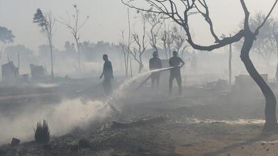 Firefighters dousing the blaze that gutted around 40 hutments at a slum located on shamlat land in Sundra village, Dera Bassi. (HT Photo) Firefighters dousing the blaze that gutted around 40 hutments at a slum located on shamlat land in Sundra village, Dera Bassi. (HT Photo)