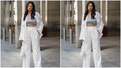 The images are from Harnaaz's trip to Manhattan, New York. They show her posing in the city, dressed in a glamorous outfit that mixed modern-day elegance with retro vibes. Her get-up features a silver crop top teamed with an oversized shirt and pants set. While the top and shirt are from H&M, the pants are from the shelves of the clothing label Ramy Brook. (Instagram/@harnaazsandhu_03) The images are from Harnaaz's trip to Manhattan, New York. They show her posing in the city, dressed in a glamorous outfit that mixed modern-day elegance with retro vibes. Her get-up features a silver crop top teamed with an oversized shirt and pants set. While the top and shirt are from H&M, the pants are from the shelves of the clothing label Ramy Brook. (Instagram/@harnaazsandhu_03)