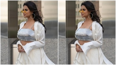 The 22-year-old beauty queen chose minimal accessories to style the all-white and silver ensemble. She went for tinted vintage sunglasses, silver hoop earrings, silver statement rings, a bracelet, matching high heels and a quirky white mini shoulder bag. In the end, Harnaaz rounded it all off with open tresses and dewy make-up. (Instagram/@harnaazsandhu_03) The 22-year-old beauty queen chose minimal accessories to style the all-white and silver ensemble. She went for tinted vintage sunglasses, silver hoop earrings, silver statement rings, a bracelet, matching high heels and a quirky white mini shoulder bag. In the end, Harnaaz rounded it all off with open tresses and dewy make-up. (Instagram/@harnaazsandhu_03)