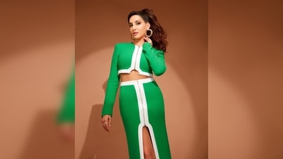 Nora Fatehi's outfit is by international designer David Koma. She paired her look with hoop earrings by Kushal's Fashion Jewellery. (Instagram/@norafatehi)