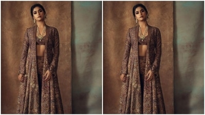 Keerthy teamed a multicoloured bra with a long skirt and a dramatic shrug with full sleeves as she posed like a diva for the cameras. (Instagram/@keerthysureshofficial)