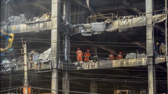 Survivors said that there were no windows in the hall on the second floor. Glass panels that covered the building on all sides were bolted, leaving just one exit from the inferno — a lone staircase. But this route was also blocked by the blazes. (Raj K Raj/HT Photo)