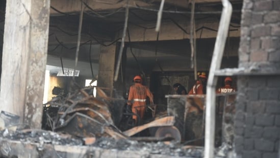 The fire reportedly broke out at the first floor of the building that housed the office of a firm that manufactures CCTV cameras and Wi-Fi routers, officials said.(Raj K Raj/Hindustan Times)