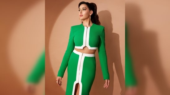Nora Fatehi's outfit comes with a cropped zipped top and a body-fitted pencil skirt featuring a slit in the middle and semi zip detailing.(Instagram/@norafatehi)