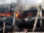 Firefighters try to douse the fire that broke out in a building near Mundka metro station, in New Delhi on Friday. (ANI)