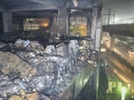 The building which has been engulfed in fire had a car showroom and office spaces. It is close to the Mundka metro station.(Sanchit Khanna/Hindustan Times) The building which has been engulfed in fire had a car showroom and office spaces. It is close to the Mundka metro station.(Sanchit Khanna/Hindustan Times)