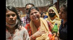 Family members of the people missing after a massive fire at an office building near the Mundka metro station, New Delhi, May 15, (PTI) Family members of the people missing after a massive fire at an office building near the Mundka metro station, New Delhi, May 15, (PTI)