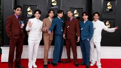 BTS pose on the red carpet as they attend the 64th Annual Grammy Awards. (REUTERS)