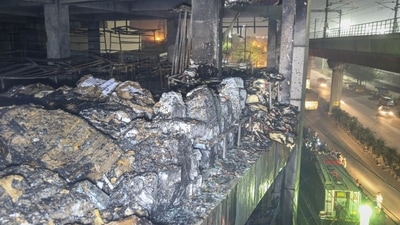 The building which has been engulfed in fire had a car showroom and office spaces. It is close to the Mundka metro station. (Sanchit Khanna/Hindustan Times) The building which has been engulfed in fire had a car showroom and office spaces. It is close to the Mundka metro station. (Sanchit Khanna/Hindustan Times)