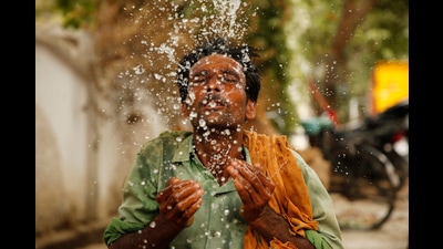 An Indian worker splashes water on his face to cool himself on a hot summer afternoon in Prayagraj, Uttar Pradesh, India, June 13 (AP) An Indian worker splashes water on his face to cool himself on a hot summer afternoon in Prayagraj, Uttar Pradesh, India, June 13 (AP)