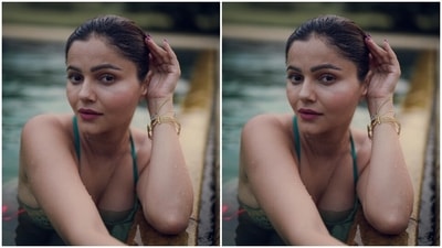 Rubina teamed the bikini top with matching bikini bottoms in dual turquoise blue and parrot green shades with ties on either side in neon pink colours. The low-rise bottoms rounded off the actor's bikini set, which she styled with minimal aesthetics. (Instagram/@rubinadilaik) Rubina teamed the bikini top with matching bikini bottoms in dual turquoise blue and parrot green shades with ties on either side in neon pink colours. The low-rise bottoms rounded off the actor's bikini set, which she styled with minimal aesthetics. (Instagram/@rubinadilaik)