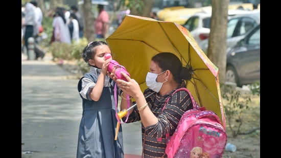 One of the major concerns in summer is dehydration and parents are making sure that the children carry a bottle of water every time they step out of the house.  (Photo: Raj K Raj/HT)