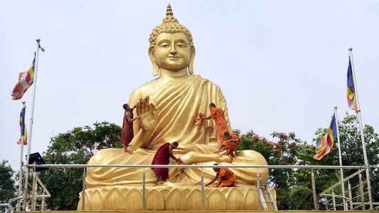 Buddist priests cleaning a monumental statue of Lord Buddha ahead of Buddha Purnima, in Howrah on Friday&nbsp;(Utpal Sarkar/ANI Photo)