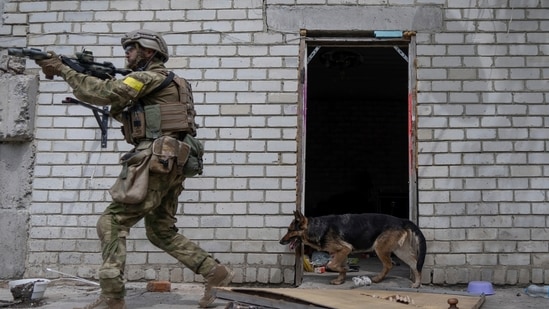 A Ukrainian serviceman patrols during a reconnaissance mission in a recently retaken village on the outskirts of Kharkiv, on May 14, 2022.&nbsp;(AP)