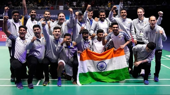 India's team members pose with their nation flag after winning Thomas Cup title in Bangkok, Thailand, Sunday, May 15, 2022.(AP)