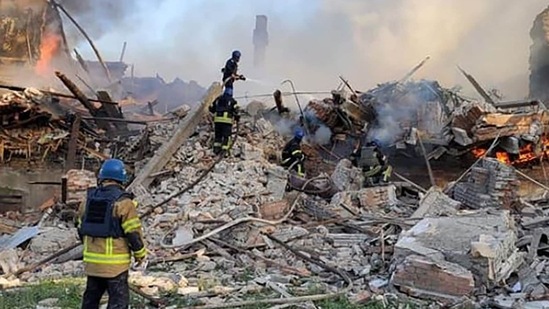 Ukrainian firefighters putting out a fire after Russian missiles hit a school in eastern Ukraine's Lugansk region. (AFP)