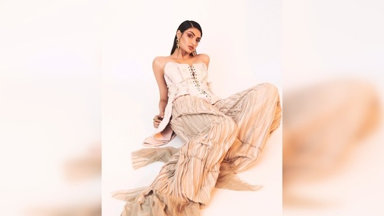 Athiya Shetty pulled off the quirky yet stylish look effortlessly as she lay on the floor for the photographer to capture some amazing frames.(Instagram/@athiyashetty)