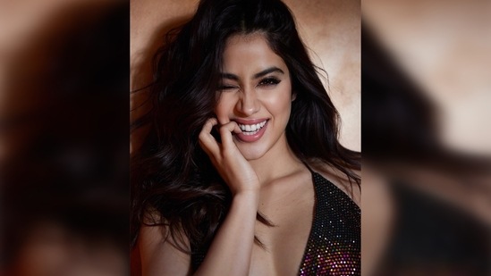 Janhvi Kapoor switches her bubbly mode on and winked at the camera with a wide smile on her face and biting her pinky finger.(Instagram/@janhvikapoor)