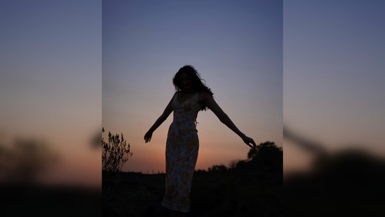 Athiya Shetty flaunted her dress at the perfect hour of the day, while the sun is setting in the background. She captioned her silhouette post, "a few sunsets ago."(Instagram/@athiyashetty)