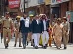 Officials leave after a videographic survey at Gyanvapi Masjid complex, in Varanasi on Sunday.(PTI)
