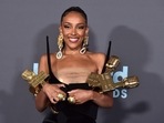 Doja Cat poses in the press room with the awards for top R&B artist, top R&B female artist, top viral song for Doja Cat poses in the press room with the awards for top R&B artist, top R&B female artist, top viral song for