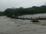 Borolia river in Tamulpur district washes away a bamboo bridge (Twitter/@PBNS_India)