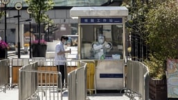 A resident takes part in a round of Covid-19 testing during a lockdown in Shanghai, China