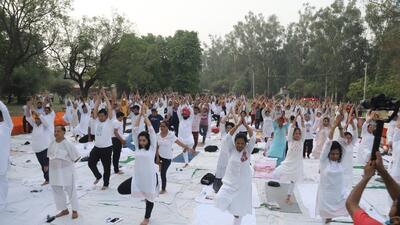 Volunteers doing yoga asanas in 63rd Yoga Mahotsav at Nehru Rose Garden in Ludhiana. (HT PHOTO) Volunteers doing yoga asanas in 63rd Yoga Mahotsav at Nehru Rose Garden in Ludhiana. (HT PHOTO)
