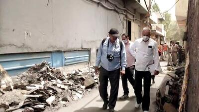 NHRC officials inspect the building near Mundka Metro Station on Monday. (ANI) NHRC officials inspect the building near Mundka Metro Station on Monday. (ANI)